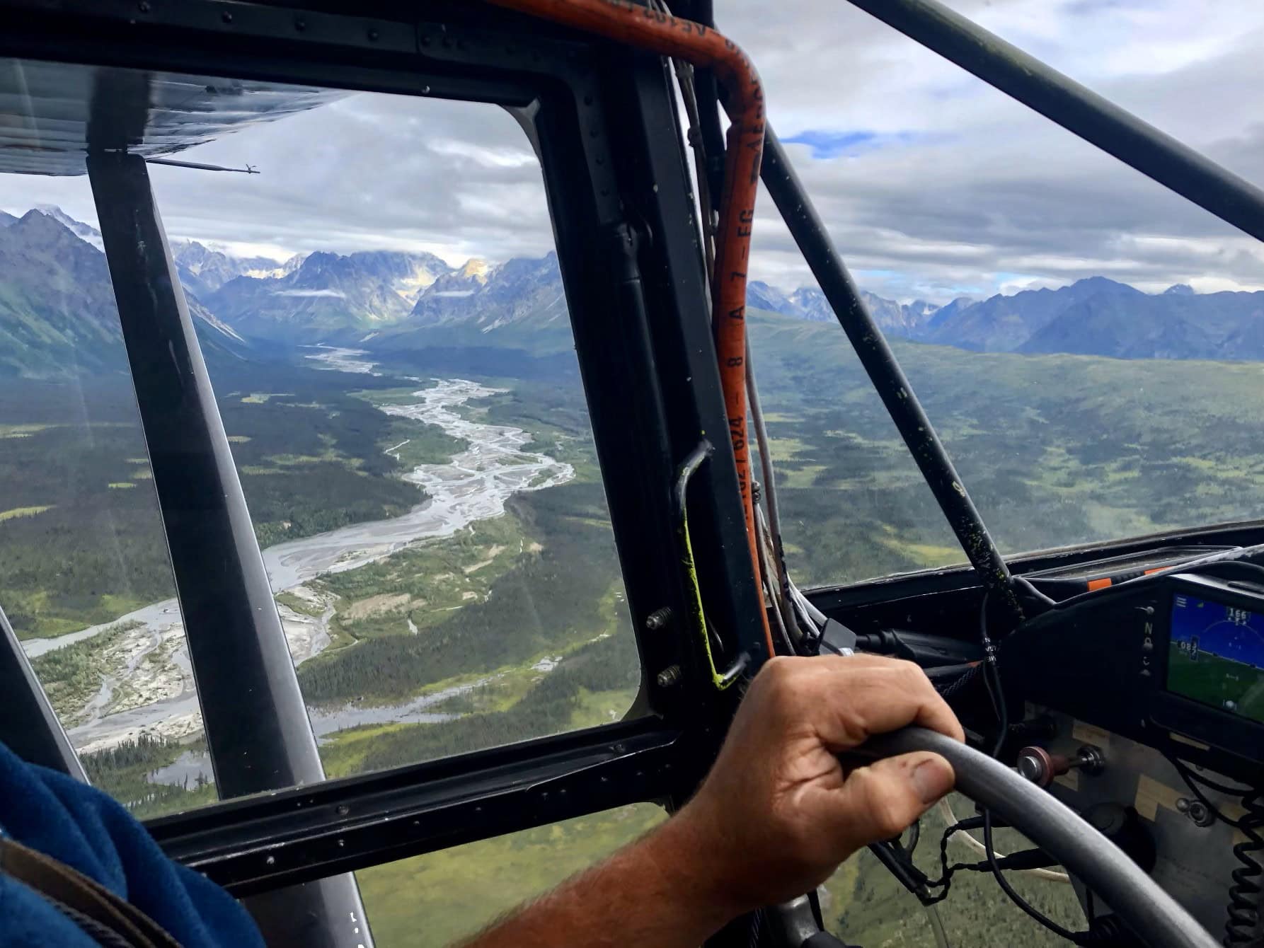 flying over a river in Lake Clark National Park