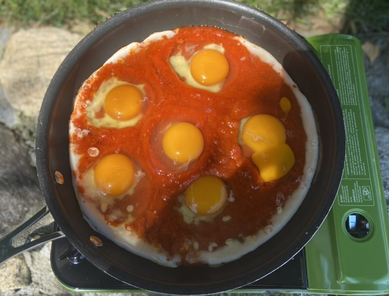 Eggs simmering for camping breakfast