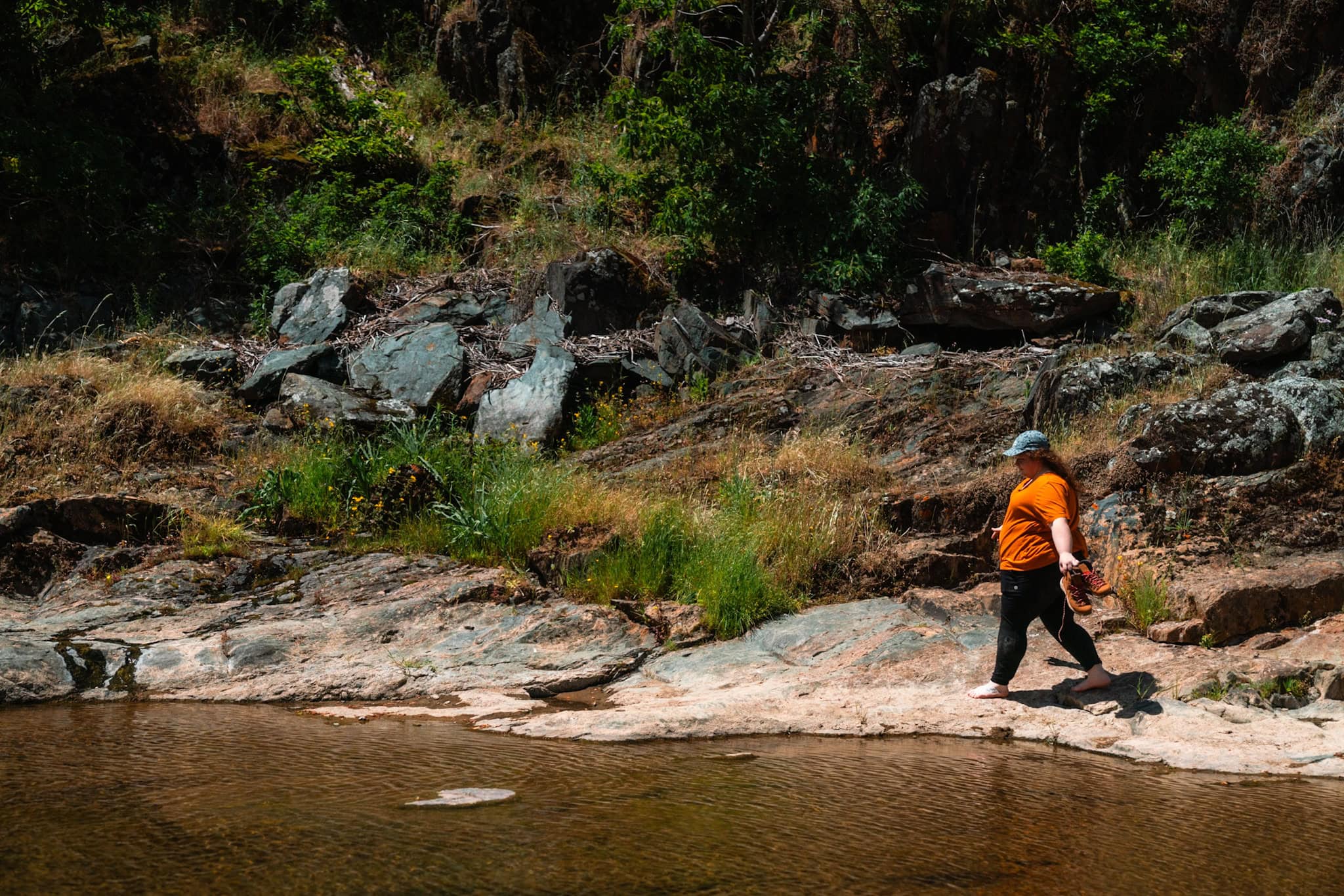 Woman walking through Hidden Falls Regional Park