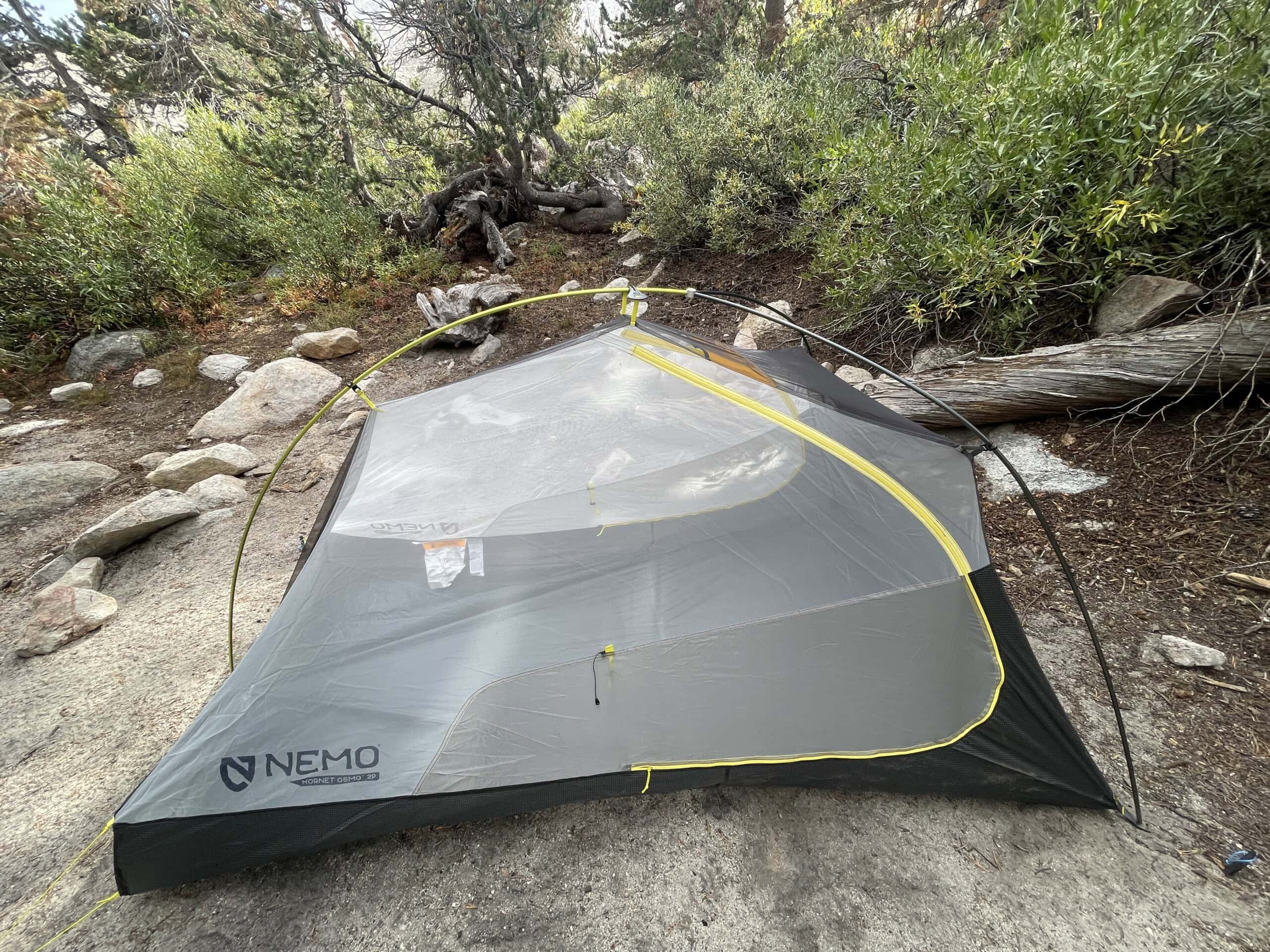 Tent with no rain fly on it in woods