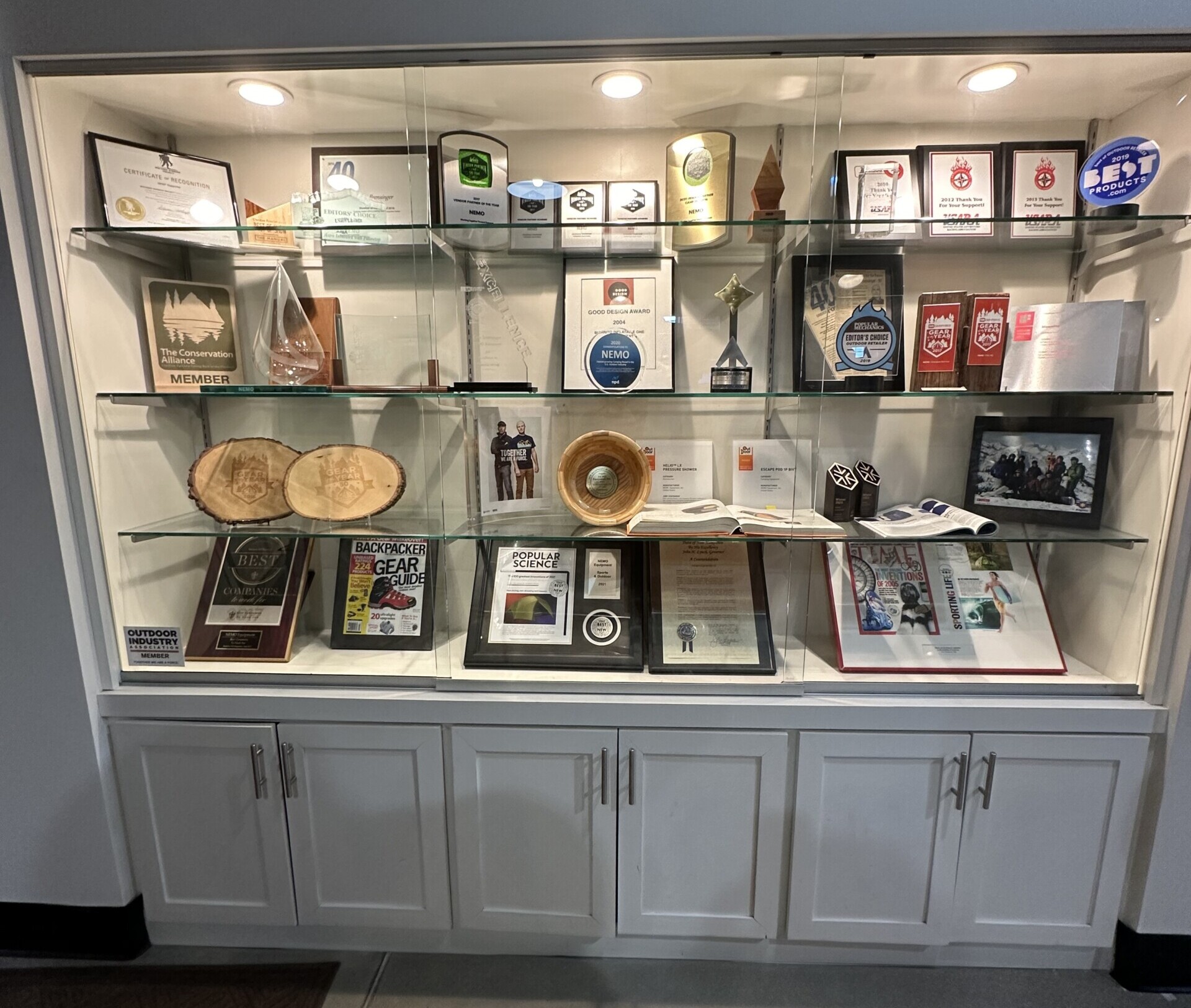 Glass cabinet filled with trophies and awards